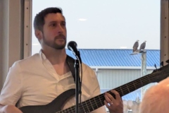 Entertainer on the ship with Eagles watching